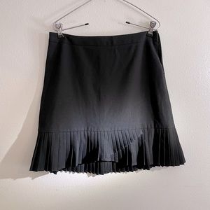 Limited Black Skirt , size 4 , stretchy , pleated detail